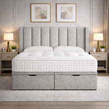 Load image into Gallery viewer, Gray upholstered bed with white mattress in a bedroom setting.
